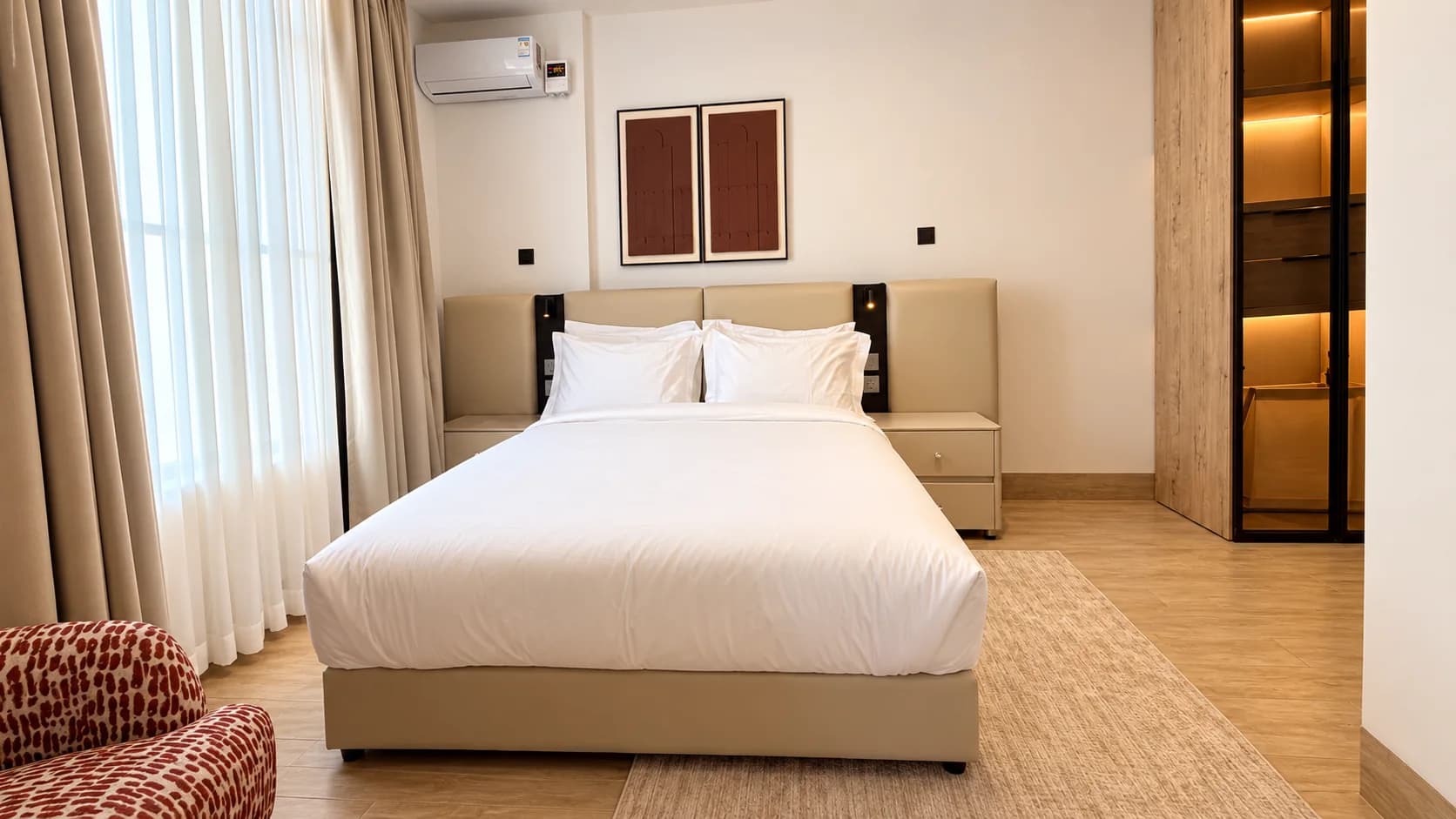 Suite bedroom dressed in white linen